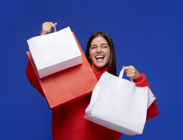 medium-shot-smiley-woman-with-bags